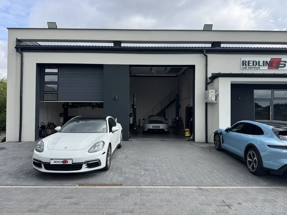 Redlines Car Service building with a Porsche Panamera and Taycan outside